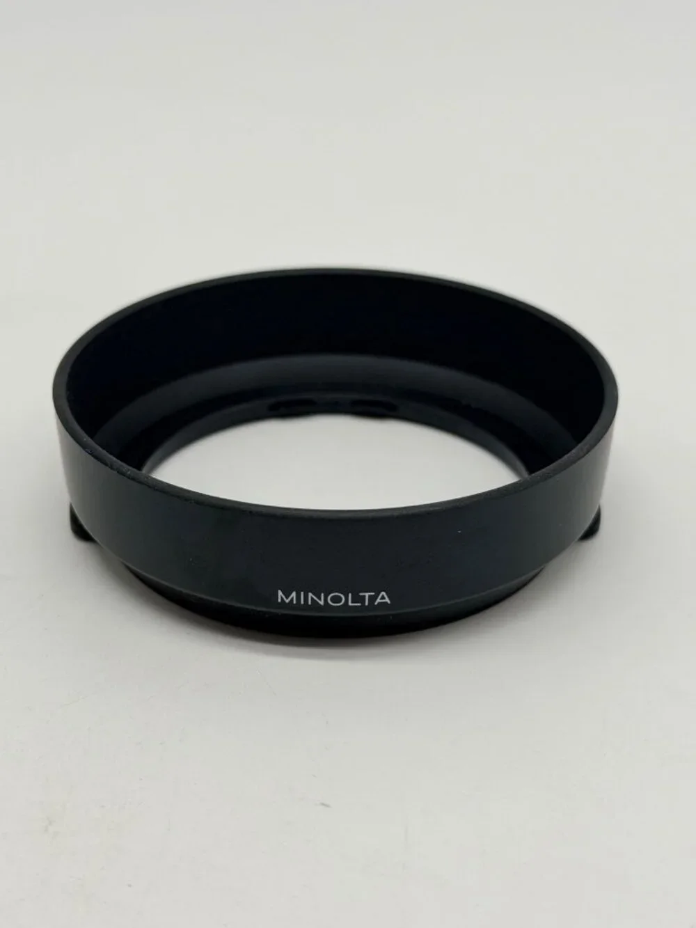 Minolta snap-on plastic lens hood specifically designed for the 35-70mm f/4 AF 